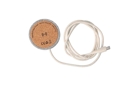 A wireless charger with a cork material top and a white Type-C cable.