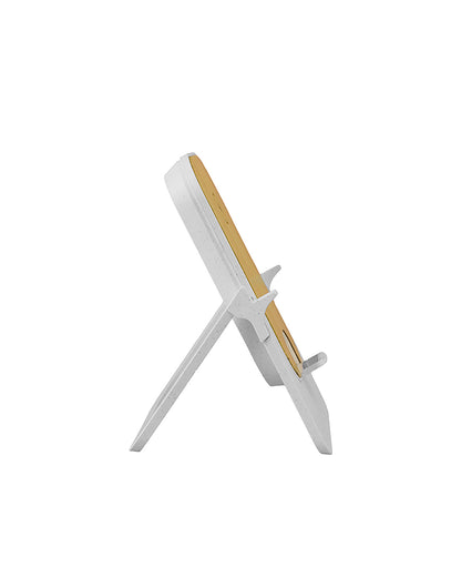 White and gold decorative item on a white background