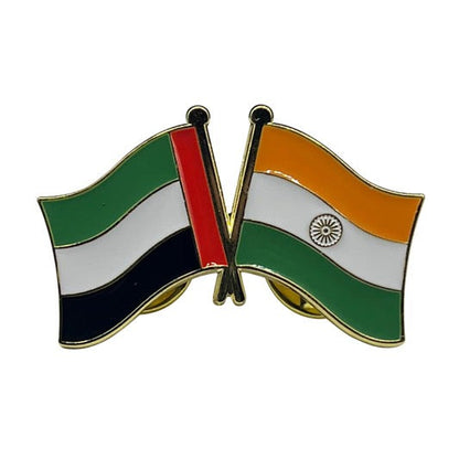 Pin with crossed flags of United Arab Emirates and India on a white background