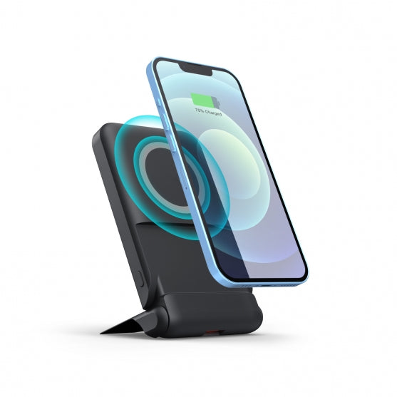 Wireless charging stand with a smartphone on a white background