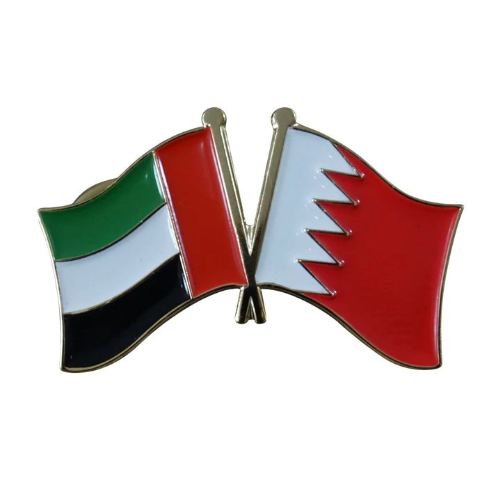 Pin with crossed flags of United Arab Emirates and Bahrain on a white background