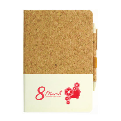 Notebook with cork texture cover and pink design on a white background