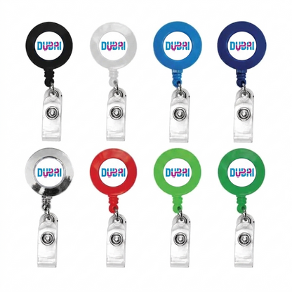 Set of eight reel badge holders with 'Dubai' branding in various colors on a white background.
