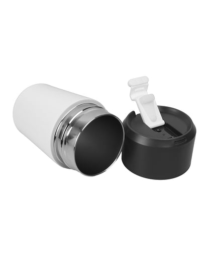 White and black travel mug with a spoon on a white background