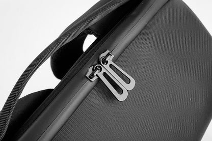 Close-up of a black suitcase with a zipper on a white background