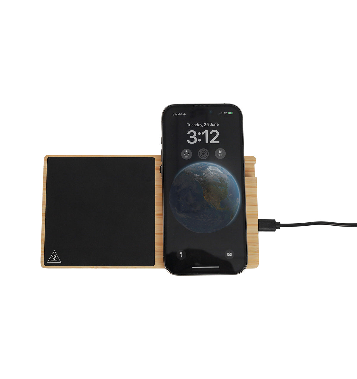A bamboo wireless charger with a smartphone placed on top of it, indicating the charging function, with a temperature indicator screen on the phone displaying the temperature of the beverage below.