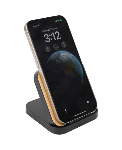 Smartphone on a black and wood-patterned stand with a white background