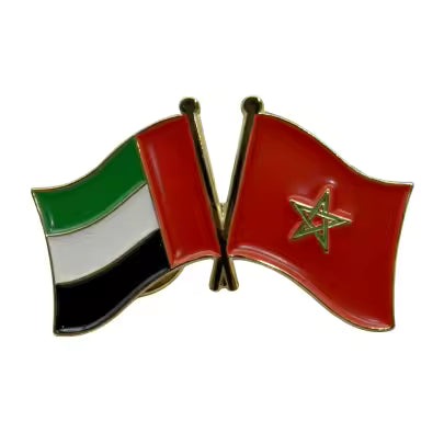 Pin with crossed flags of United Arab Emirates and Morocco on a white background