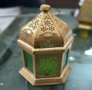 Decorative hexagonal object with intricate designs on a reflective surface