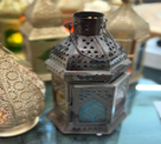 Decorative bottles with intricate designs on a dark background