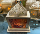 Decorative lantern with intricate design on a white background