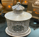 Decorative lantern with intricate design on a white background