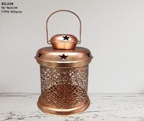 Copper lantern with star design on a wooden surface