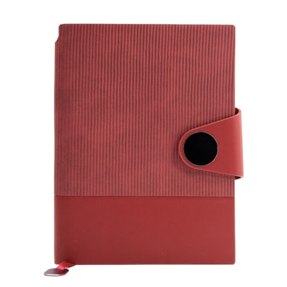 Red notebook with a circular strap on a white background