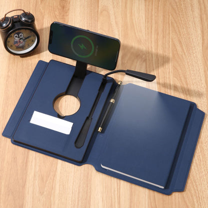 Blue stationery set with a phone stand, pen, and notebook on a wooden surface.