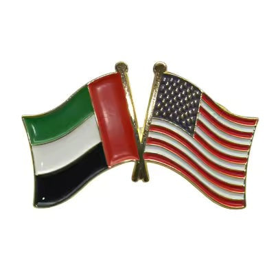 Pin with flags of the United Arab Emirates and the United States on a white background