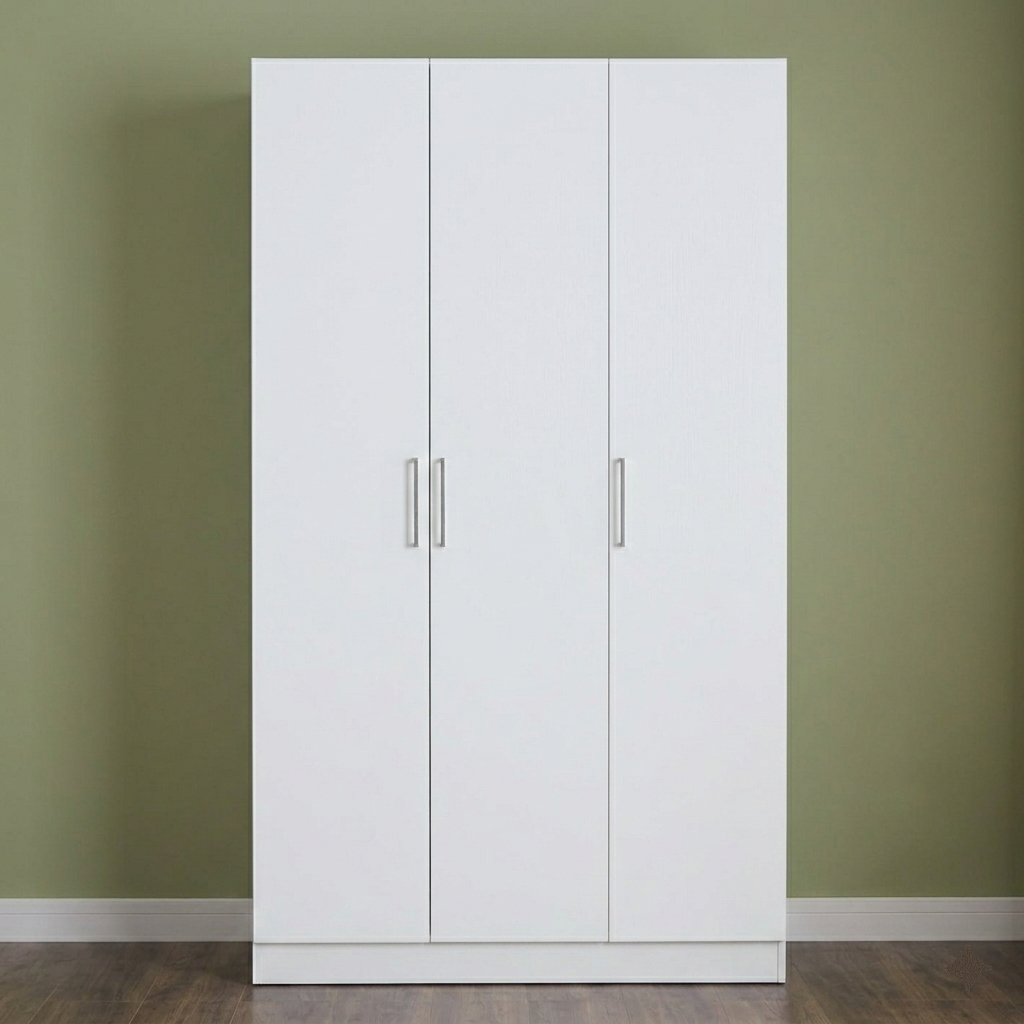 White wardrobe with silver handles against a green wall