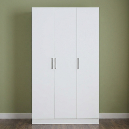White wardrobe with silver handles against a green wall