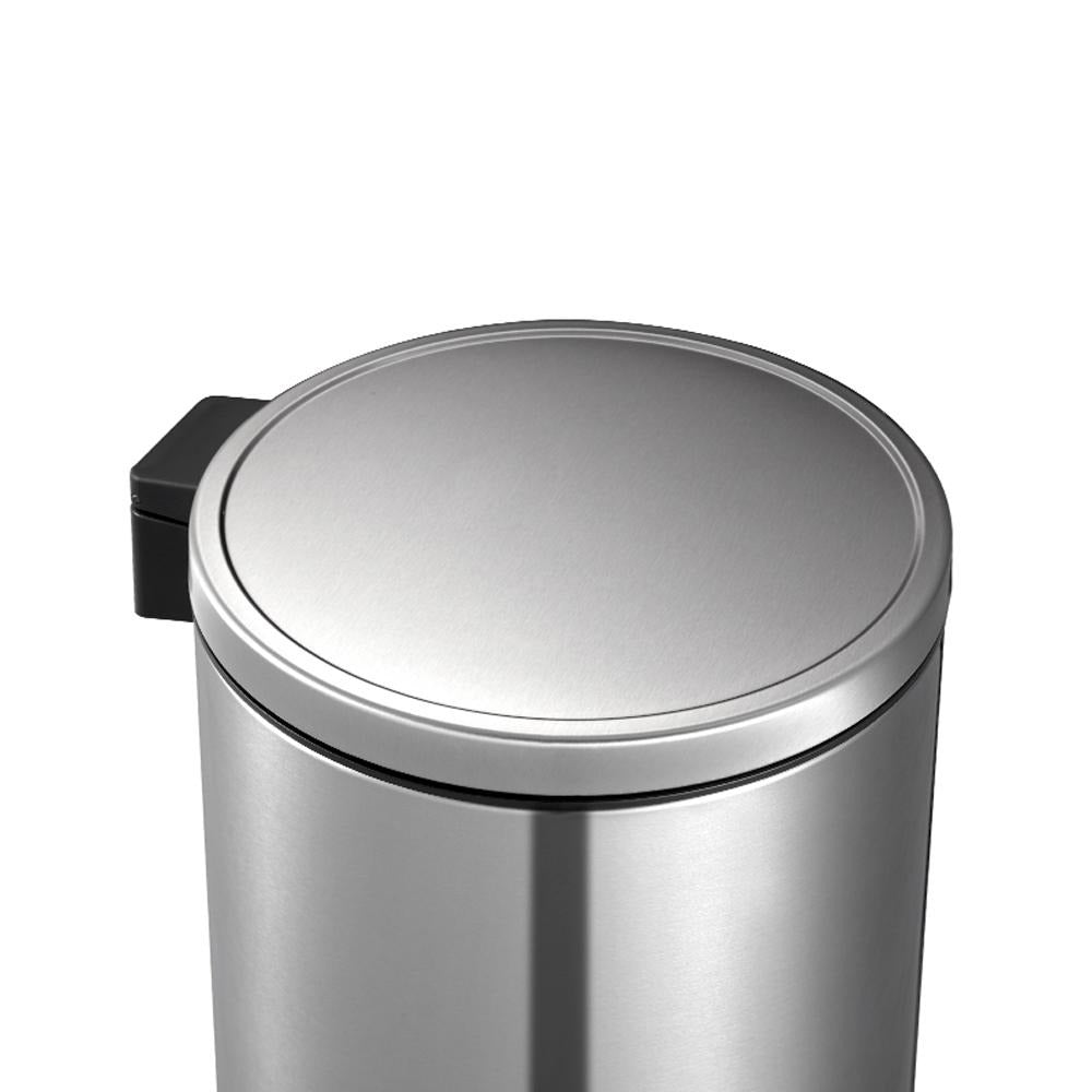 Silver trash can with a lid on a white background