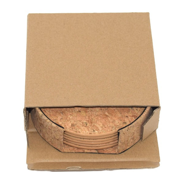 Cork coasters stacked inside a cardboard box on a white background