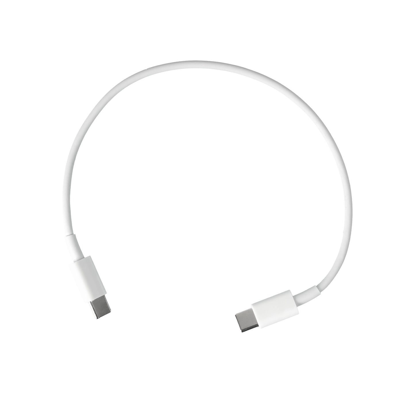White travel-sized Mini Travel Cable Kit  with open lid on a brown surface