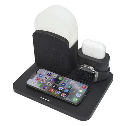 Black charging station with phone, watch, and earbuds on a white background