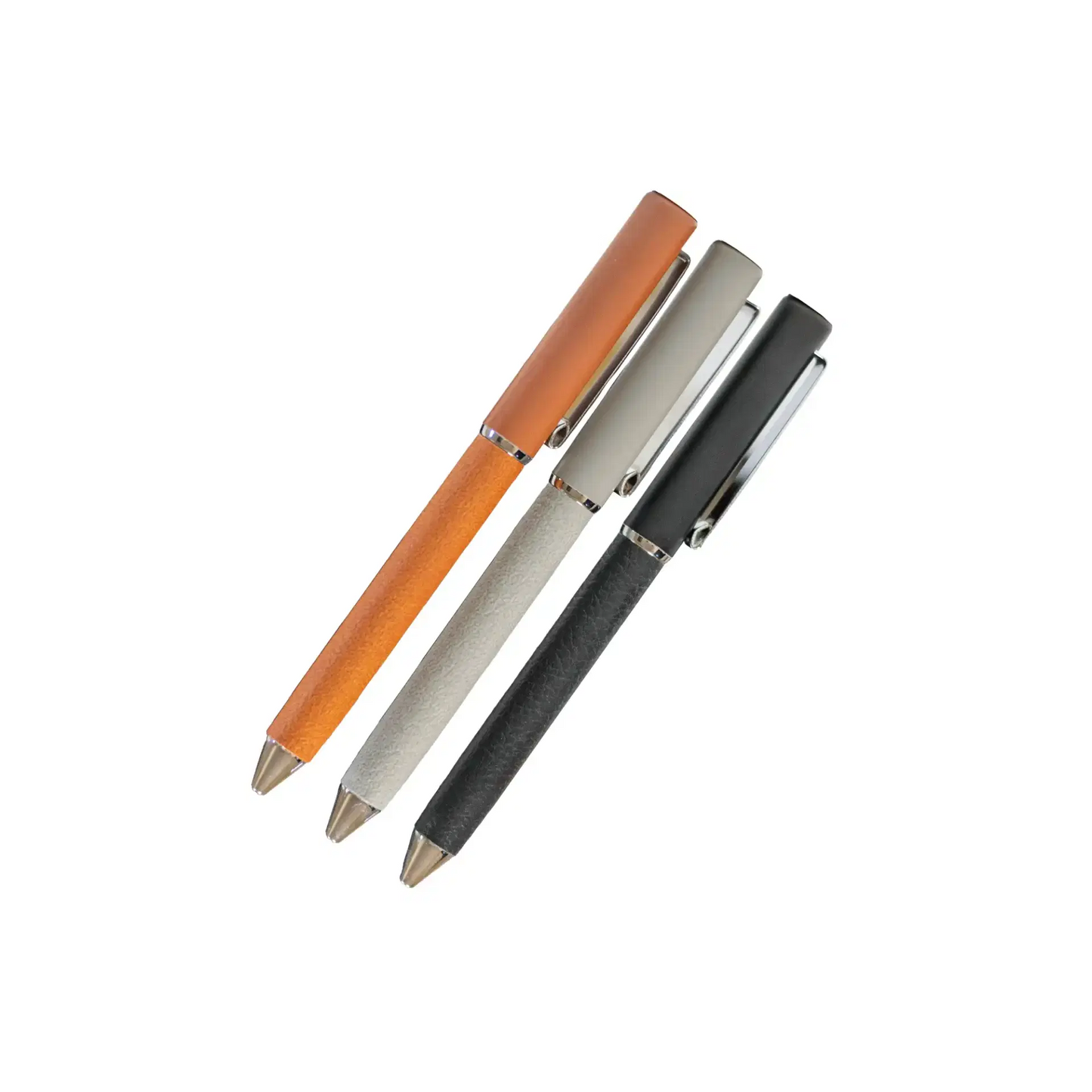 Three pens in orange, silver, and black on a white background