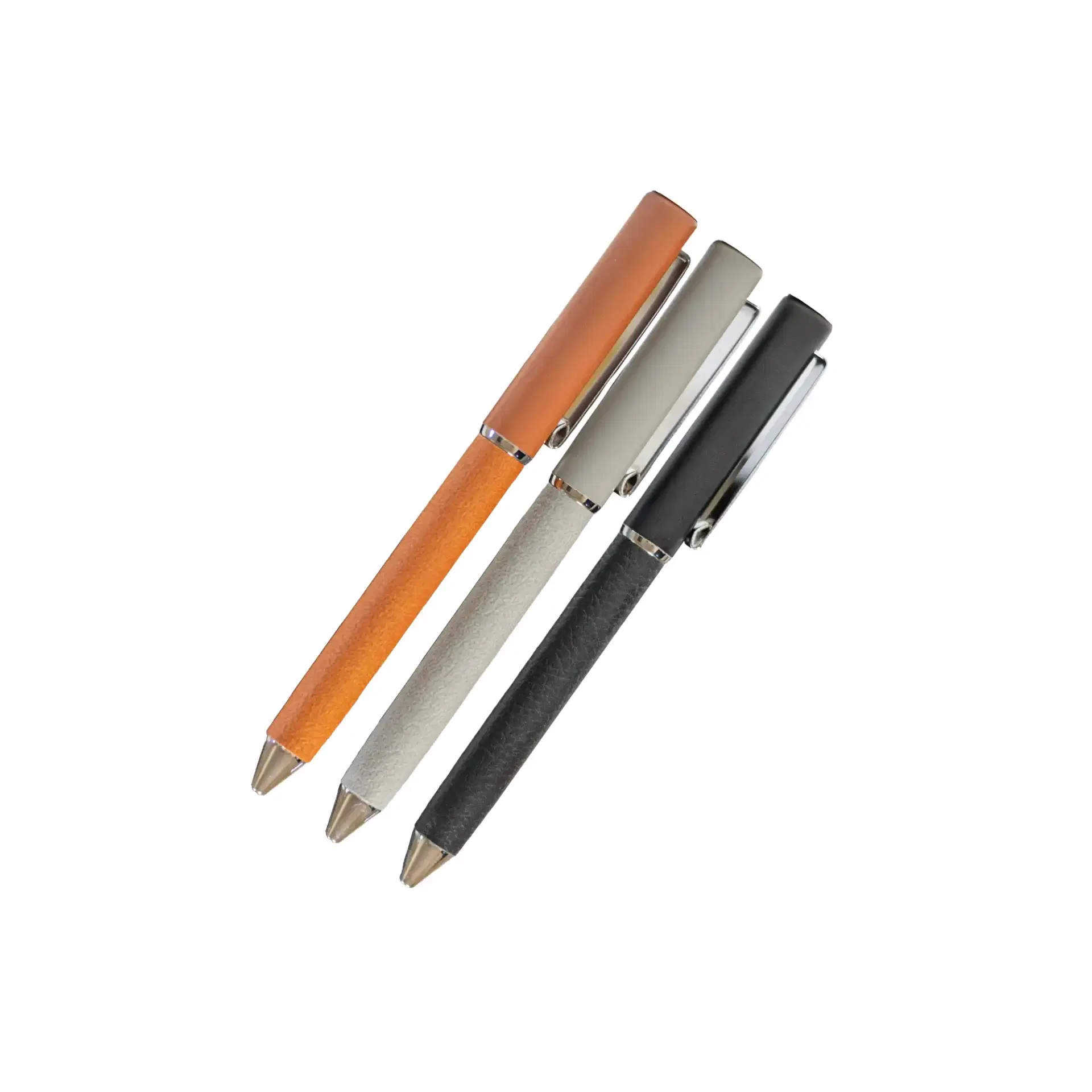 Three pens in orange, silver, and black on a white background