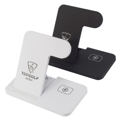 Two wireless charging stands, one white and one black, with Topgolf Dubai branding on a white background.