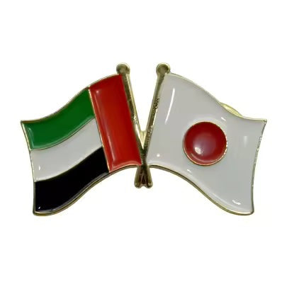 Two flags crossed over each other on a white background