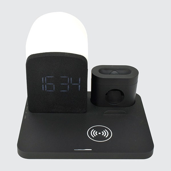 Black electronic device with digital display and wireless charging pad on a white background