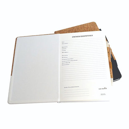 Open notebook with cork cover and pencil on a white background